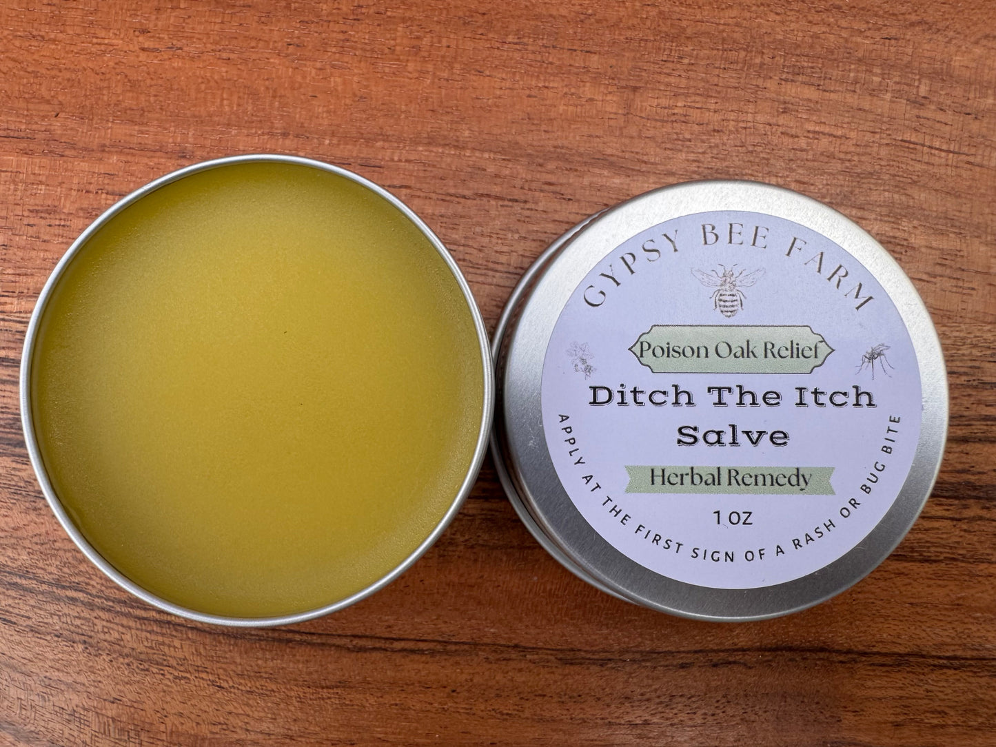 Gypsy Bee Farm Ditch The Itch Salve on a wooden surface