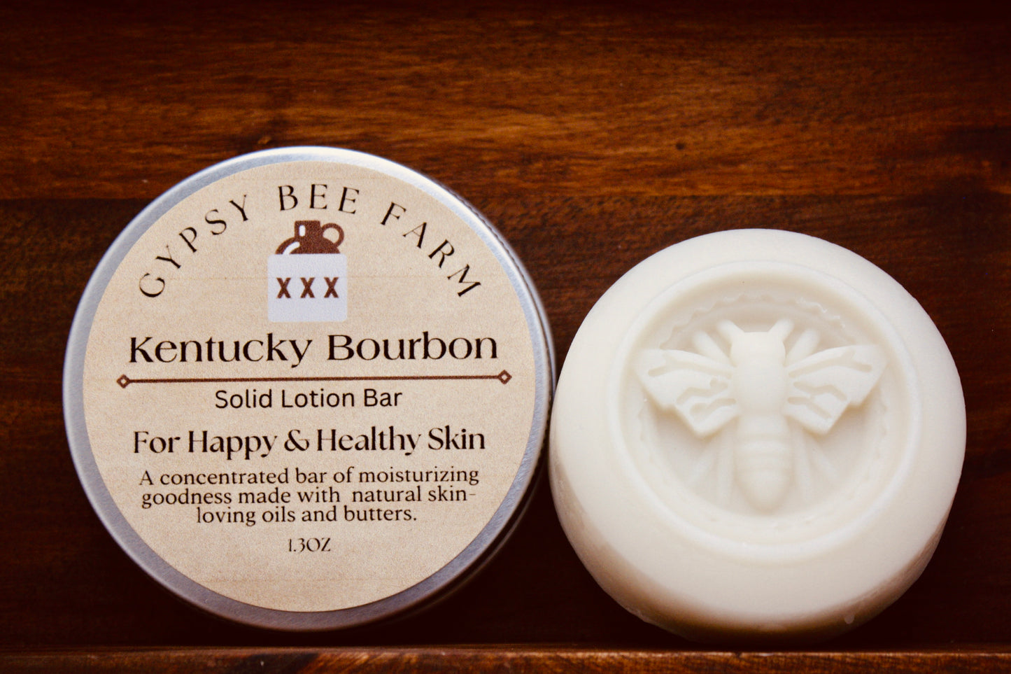 Gypsy Bee Farm Kentucky Bourbon solid lotion bar on a wooden surface