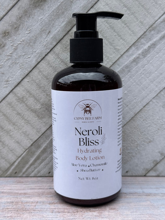 Neroli Bliss body lotion bottle on a wooden surface