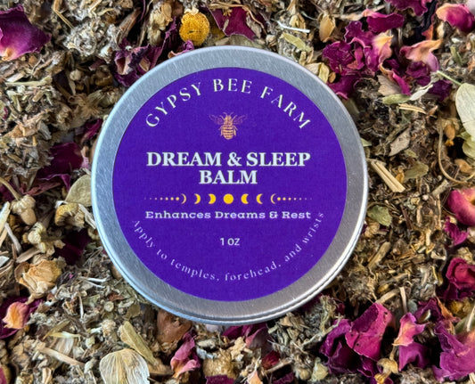 Gypsy Bee Farm Dream & Sleep Balm tin surrounded by dried herbs and flowers